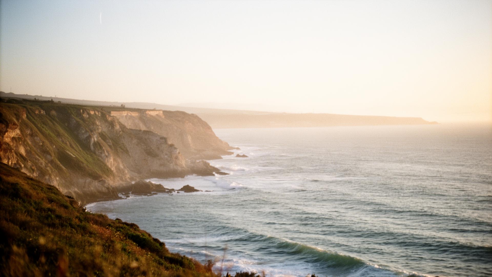 Quiet Portuguese Atlantic coastline at golden hour, refined natural environment
